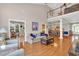 Spacious living room showcasing hardwood floors and an open layout with seamless transitions to the dining area at 8013 Wacobee Dr., Myrtle Beach, SC 29579