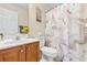 Bathroom featuring sink vanity, floral decorations, and marbled shower curtain at 864 Barn Owl Ct. # 864, Myrtle Beach, SC 29579
