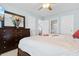 Spacious bedroom featuring a large bed, dresser, and an inviting view of the en-suite bathroom at 864 Barn Owl Ct. # 864, Myrtle Beach, SC 29579