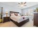 Comfortable bedroom with a ceiling fan, large bed, and natural light from the shuttered windows at 864 Barn Owl Ct. # 864, Myrtle Beach, SC 29579