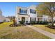 Charming two-story home with an American flag displayed and lush landscaping at 864 Barn Owl Ct. # 864, Myrtle Beach, SC 29579