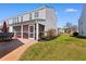 Back exterior featuring a screened porch and an open patio, enhancing outdoor living at 864 Barn Owl Ct. # 864, Myrtle Beach, SC 29579