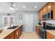 Kitchen with stainless steel appliances, wood cabinetry, and access to the dining room at 864 Barn Owl Ct. # 864, Myrtle Beach, SC 29579