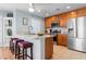 Kitchen with stainless steel appliances, breakfast bar and wood cabinetry at 864 Barn Owl Ct. # 864, Myrtle Beach, SC 29579