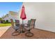 Charming brick patio with a round table, umbrella, and seating, perfect for outdoor relaxation and entertainment at 864 Barn Owl Ct. # 864, Myrtle Beach, SC 29579