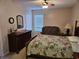 Bedroom featuring a bed with floral bedding, a dresser, and seating area at 927 Edge Dr., North Myrtle Beach, SC 29582