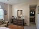 Bedroom featuring a dresser and view of en suite bathroom at 927 Edge Dr., North Myrtle Beach, SC 29582