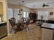 Bright dining area with wicker chairs, tile flooring, and views into the living room at 927 Edge Dr., North Myrtle Beach, SC 29582