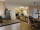 Functional kitchen and dining area featuring stainless steel appliances and wicker dining chairs at 927 Edge Dr., North Myrtle Beach, SC 29582