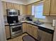 Well-lit kitchen with stainless steel appliances and ample counter space at 927 Edge Dr., North Myrtle Beach, SC 29582