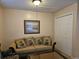 Comfortable living room featuring a cozy couch with pineapple pillows and a framed artwork at 927 Edge Dr., North Myrtle Beach, SC 29582
