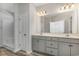 Bathroom with double vanity, gray cabinets, and walk-in shower at 1004 Woodside Dr., Conway, SC 29526