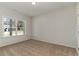 A carpeted bedroom with a large window providing natural light at 1004 Woodside Dr., Conway, SC 29526