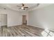 A spacious bedroom with wood floors and an adjoining doorway at 1004 Woodside Dr., Conway, SC 29526
