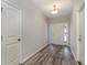 Inviting entryway featuring wood-look flooring, a white front door with sidelights, and neutral paint at 1004 Woodside Dr., Conway, SC 29526