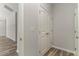 Hallway with hardwood flooring and a large storage closet at 1004 Woodside Dr., Conway, SC 29526