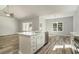Kitchen island with a stainless steel dishwasher, a breakfast bar, and modern fixtures at 1004 Woodside Dr., Conway, SC 29526