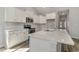 Bright kitchen with stainless appliances, white cabinets, and white countertop island at 1004 Woodside Dr., Conway, SC 29526