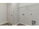 Laundry room featuring connections, wire shelving, and a door at 1004 Woodside Dr., Conway, SC 29526
