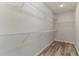 Walk-in closet featuring wire shelving and wood-look flooring at 1004 Woodside Dr., Conway, SC 29526