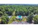 Aerial view of community pool, tennis courts and surrounding greenery at 10301 North Kings Hwy. # 21-4, Myrtle Beach, SC 29572