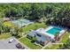 Aerial view of the community amenities including a pool, tennis courts, and clubhouse at 10301 North Kings Hwy. # 21-4, Myrtle Beach, SC 29572