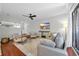 Warm and inviting living room showcasing stylish seating, a flat-screen television, and outdoor access at 10301 North Kings Hwy. # 21-4, Myrtle Beach, SC 29572