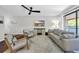 Bright living room featuring modern furnishings, a flat screen television, and access to outdoor balcony at 10301 North Kings Hwy. # 21-4, Myrtle Beach, SC 29572