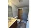 Bathroom with vanity and shower featuring a glass door at 1101 2Nd Ave. N # 403, Surfside Beach, SC 29575