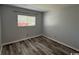 Clean bedroom with new flooring and a window providing natural light at 1101 2Nd Ave. N # 403, Surfside Beach, SC 29575