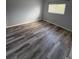 Cozy bedroom with neutral walls, updated flooring, and a window providing natural light at 1101 2Nd Ave. N # 403, Surfside Beach, SC 29575