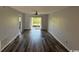 Bright living room featuring new flooring and sliding glass doors leading to outdoor space at 1101 2Nd Ave. N # 403, Surfside Beach, SC 29575
