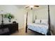 Comfortable bedroom with a four-poster bed, carpet, white walls, and a ceiling fan at 130 Puffin Dr. # 2B, Pawleys Island, SC 29585