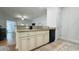 Kitchen features cream-colored cabinets, granite countertops and stainless steel sink at 130 Puffin Dr. # 2B, Pawleys Island, SC 29585