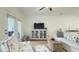 Bright living area with wood floors, stylish furniture, and a serene atmosphere at 130 Puffin Dr. # 2B, Pawleys Island, SC 29585