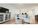Bright living room with decorative furnishings and open floorplan to kitchen area at 130 Puffin Dr. # 2B, Pawleys Island, SC 29585