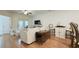 Living room features hardwood floors, white sofa, and a ceiling fan at 130 Puffin Dr. # 2B, Pawleys Island, SC 29585
