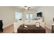 Living room features hardwood floors, white sofa, and a ceiling fan at 130 Puffin Dr. # 2B, Pawleys Island, SC 29585