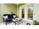 Outdoor patio with comfortable seating and access to interior through French doors at 130 Puffin Dr. # 2B, Pawleys Island, SC 29585