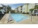 Community pool with chairlift and ample seating areas at 130 Puffin Dr. # 2B, Pawleys Island, SC 29585