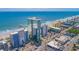 Aerial view capturing the condo buildings, pristine coastline, and vibrant beach scene at 1304 N Ocean Blvd. # S-801, Myrtle Beach, SC 29577