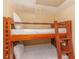 Wooden bunk beds with comfortable white linens in bedroom at 1304 N Ocean Blvd. # S-801, Myrtle Beach, SC 29577