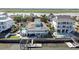 Breathtaking aerial view of waterfront home featuring a pool, dock, and outdoor space at 1885 Pompano Dr., Garden City Beach, SC 29576