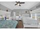 Inviting bedroom featuring two beds, neutral tones, and waterfront views for a serene retreat at 1885 Pompano Dr., Garden City Beach, SC 29576