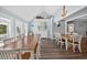 Open dining room with vaulted ceilings and coastal decor at 1885 Pompano Dr., Garden City Beach, SC 29576