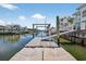 Private dock with boat lift offering convenient access to the water, perfect for boating and water activities at 1885 Pompano Dr., Garden City Beach, SC 29576
