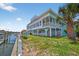 Beautiful waterfront home with a dock, patio, and coastal charm at 1885 Pompano Dr., Garden City Beach, SC 29576
