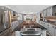 Spacious kitchen features cooktop island, updated appliances, and open floor plan at 1885 Pompano Dr., Garden City Beach, SC 29576
