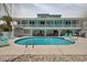 Backyard swimming pool surrounded by lounge chairs, offering the perfect setting for relaxation and entertainment at 1885 Pompano Dr., Garden City Beach, SC 29576