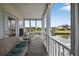 Relaxing screened porch with comfortable seating and scenic views of the water at 1885 Pompano Dr., Garden City Beach, SC 29576